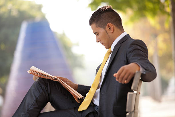 istock Businessman reading the newspaper 158341384