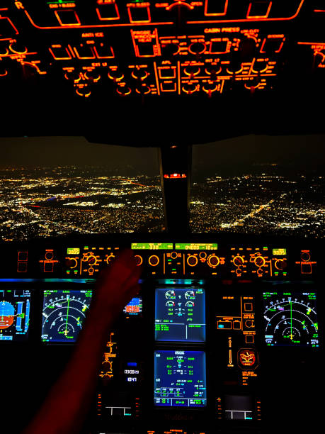 istock cockpit point of view at night pilot hand push button vertical transportation still 1583415652