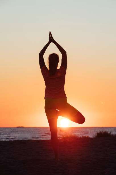 istock Yoga at the beach 1583435484