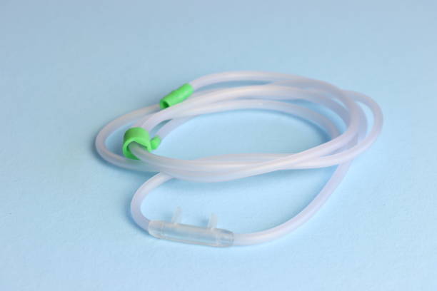 Oxygen cannula in a light blue background showing in close up the catheter