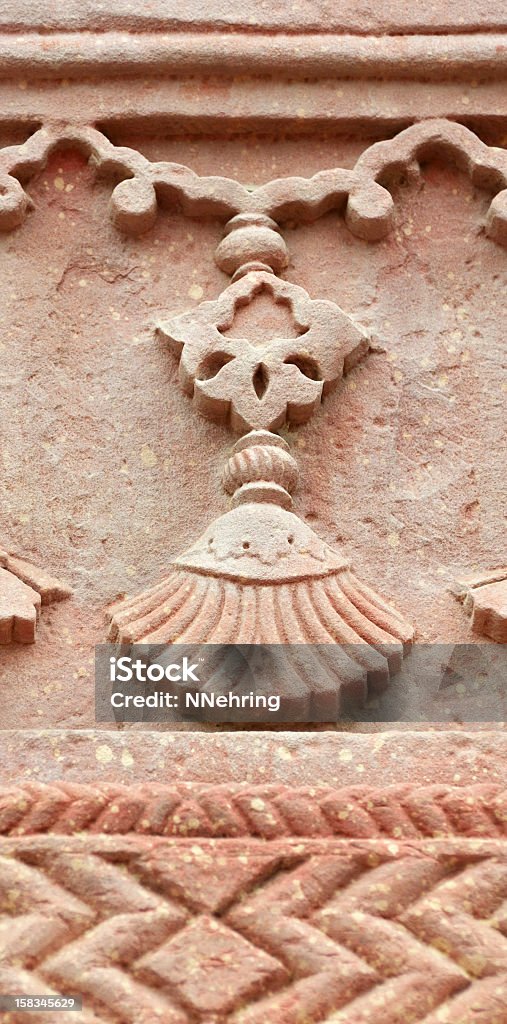 jhumka carved in stone Detail of jhumka (an earring) carved in red sandstone on the exterior of the Haramsara Offices (aka Jodhbai's Kitchen). Fathehpur Sikri, Uttar Pradesh, India. UNESCO World Heritage Site. Architecture Stock Photo