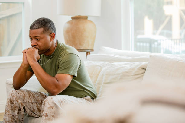 istock Sitting at home, man struggles alone with PTSD 1583458840