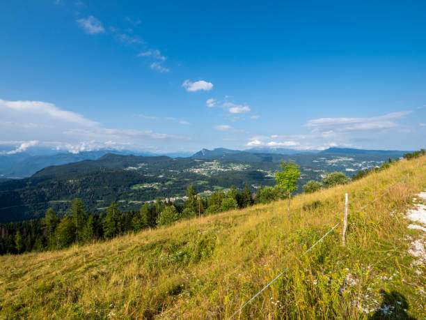 istock Alpine landscape with meadows and clouds 1583485614