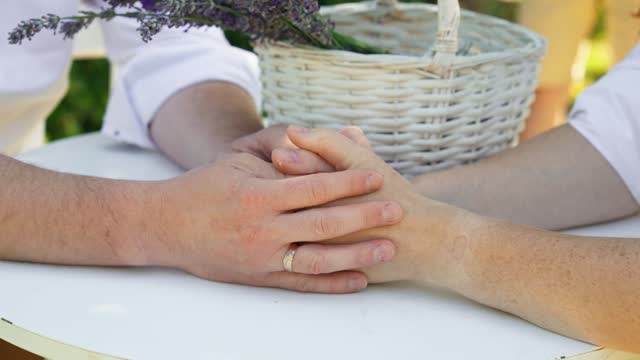 Man and woman holding hands. Love couple connecting hands.