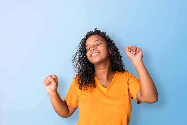 istock Black woman smiling happily and having fun 1583497316