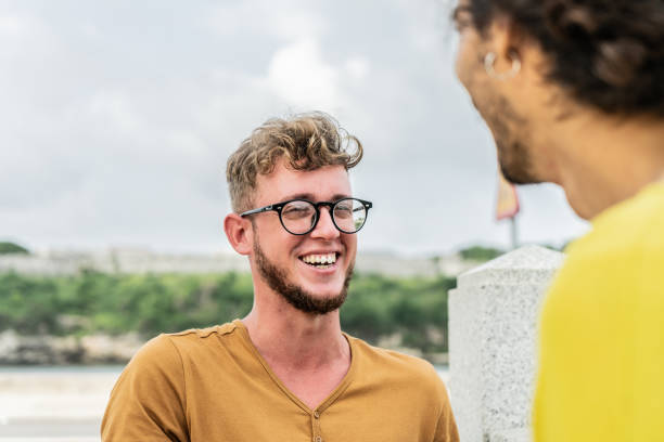 istock Young friends talking outdoors 1583500643