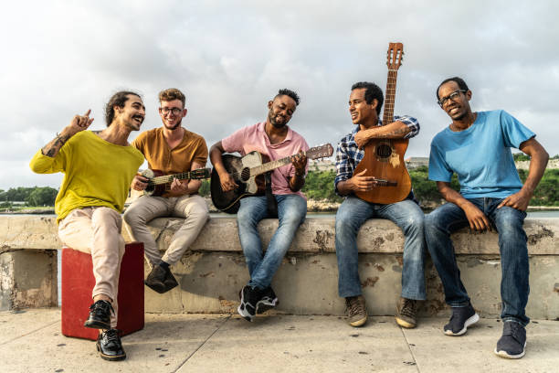Fiends playing instruments and singing outdoors