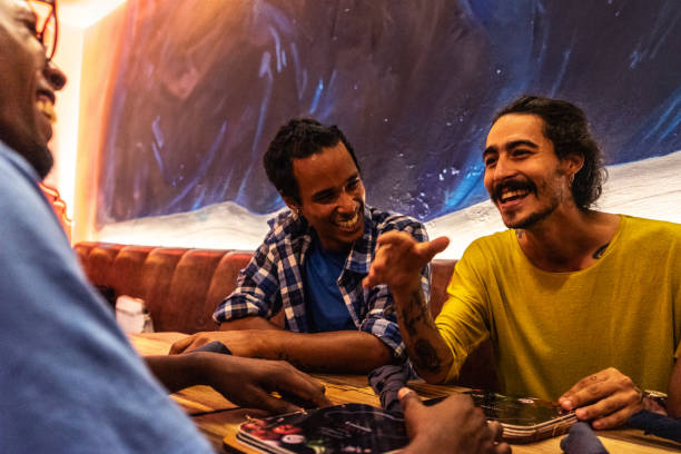 Group of young friends talking at a pub