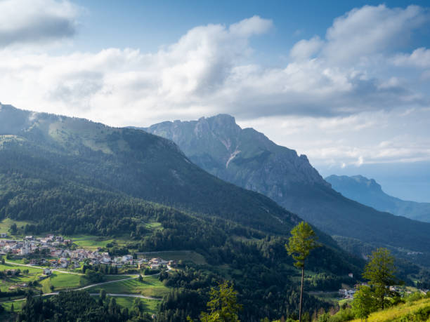 istock Alpine landscape with meadows and clouds 1583513624