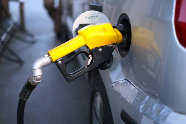 istock Pumping gasoline fuel in car 1583523197