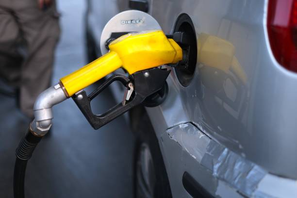 istock Pumping gasoline fuel in car 1583523298