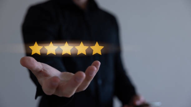 istock Customer Experience Concept, Best Excellent Services for Satisfaction present by Opened Hand of Client giving a Five Star Rating. 1583540429