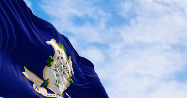 istock Connecticut state flag fluttering in the wind on a clear day 1583549632