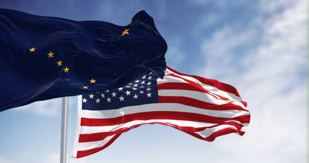 Alaska state flag waving in the wind behind the national flag of the US Alaska state flag waving in the wind with the national flag of the United States. Alaska flag is blue with Big Dipper and Polaris stars. 3d illustration render. Rippled fabric alaska us state stock pictures, royalty-free photos & images