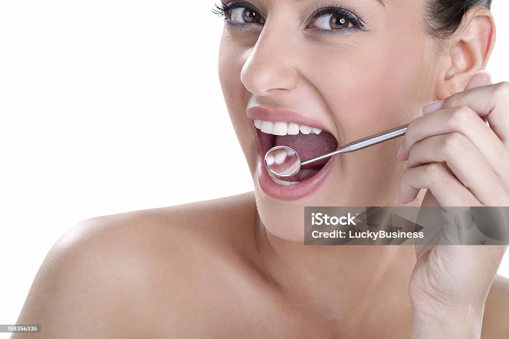 healthy teeth with dental mirror young woman with healthy teeth and dental mirror Adult Stock Photo