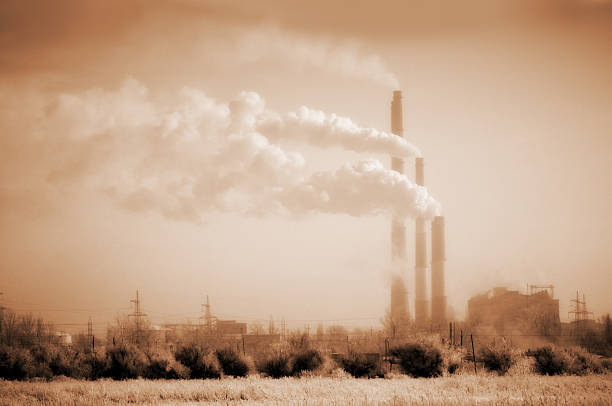 Air pollution of heavy industry. Global warming. Ecocatastrophe. Human activity since the Industrial Revolution has increased the amount of greenhouse gases in the atmosphere, leading to increased radiative forcing from CO2, methane, tropospheric ozone, CFCs and nitrous oxide. The concentrations of CO2 and methane have increased by 36% and 148% respectively since 1750. These levels are much higher than at any time during the last 650,000 years, the period for which reliable data has been extracted from ice cores. Less direct geological evidence indicates that CO2 values higher than this were last seen about 20 million years ago. Fossil fuel burning has produced about three-quarters of the increase in CO2 from human activity over the past 20 years. (From Wikipedia). earth's atmosphere stock pictures, royalty-free photos & images