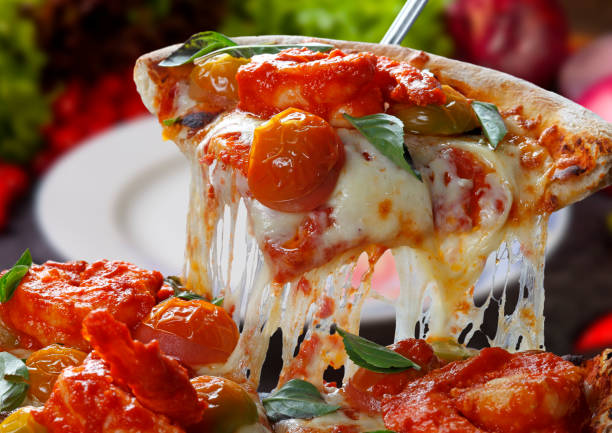 istock Slice of pizza raised 1583571259