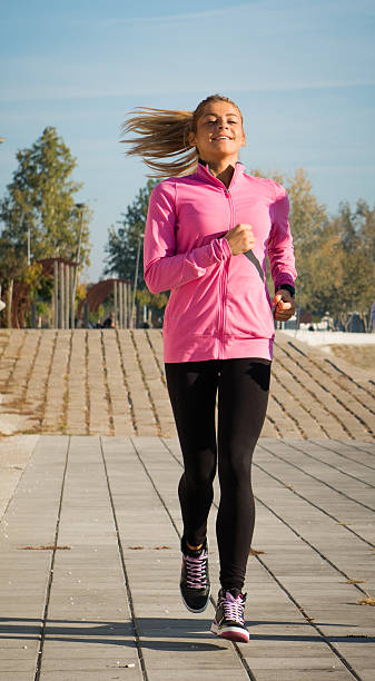 istock young girl jogging 158357873