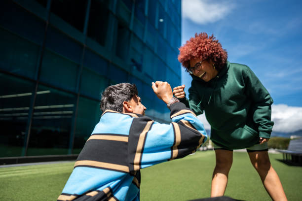 istock Friends greeting outdoors 1583582393