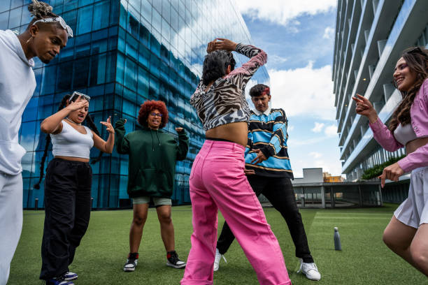 istock Group of young dancers dancing outdoors 1583589353