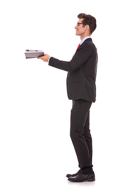 istock business man looking at something comming out of his book 158359271