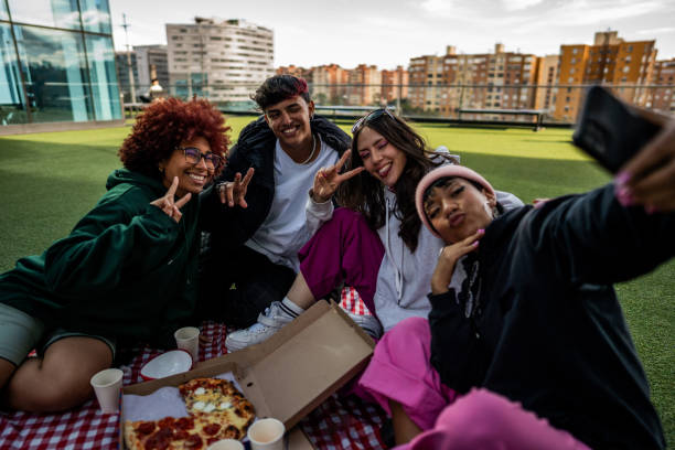 istock Friends taking a selfie during a picnic at the rooftop 1583616482