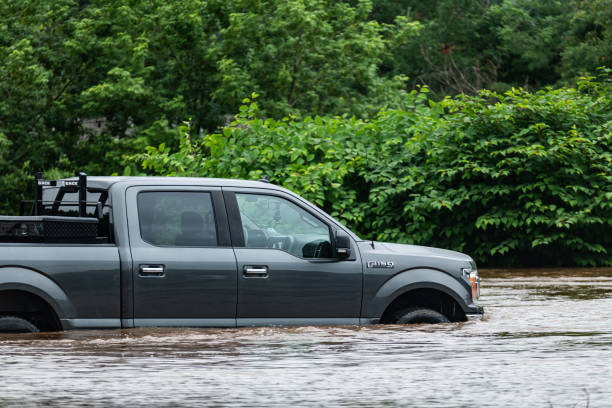 July 22, 2023 - Bedford, Nova Scotia - Record breaking rainfall brought the Sackville River well beyond it's banks, flooding much of the Bedford area & flooding this new model Ford F-150XLT pickup.