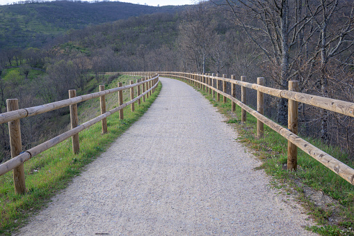 Via verde de la plata in curve fenced horizontally Eurovelo Extremadura