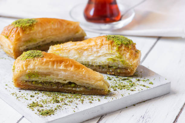 istock Traditional turkish dessert carrrot slice antep baklava with pistachio on rustic background. Desserts concept 1583715799
