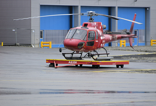 Nuuk / Godthab, Greenland: Air Greenland helicopter on a platform on the apron - Aerospatiale / Eurocopter AS 350 B3 Plus Ecureuil (registration OY-HUE, MSN 7172) -  Air Greenland is Greenland's flag carrier. It is owned by the Government of Greenland, SAS Group and the Danish state. The company has headquarters in Nuuk. It operates fixed-wing aircraft for major domestic and international routes, as well as helicopters connecting passengers from the less populated places with the national network of airports - Nuuk Airport.