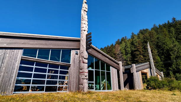 Skidegate, Haida Gwaii, British Columbia, Canada,  July 7, 2023: The Haida Heritage Centre the premier cultural centre of the Haida Nation and it’s people. Skidegate, Haida Gwaii, British Columbia, Canada,  July 7, 2023: The Haida Heritage Centre the premier cultural centre of the Haida Nation and it’s people. haida gwaii totem poles stock pictures, royalty-free photos & images