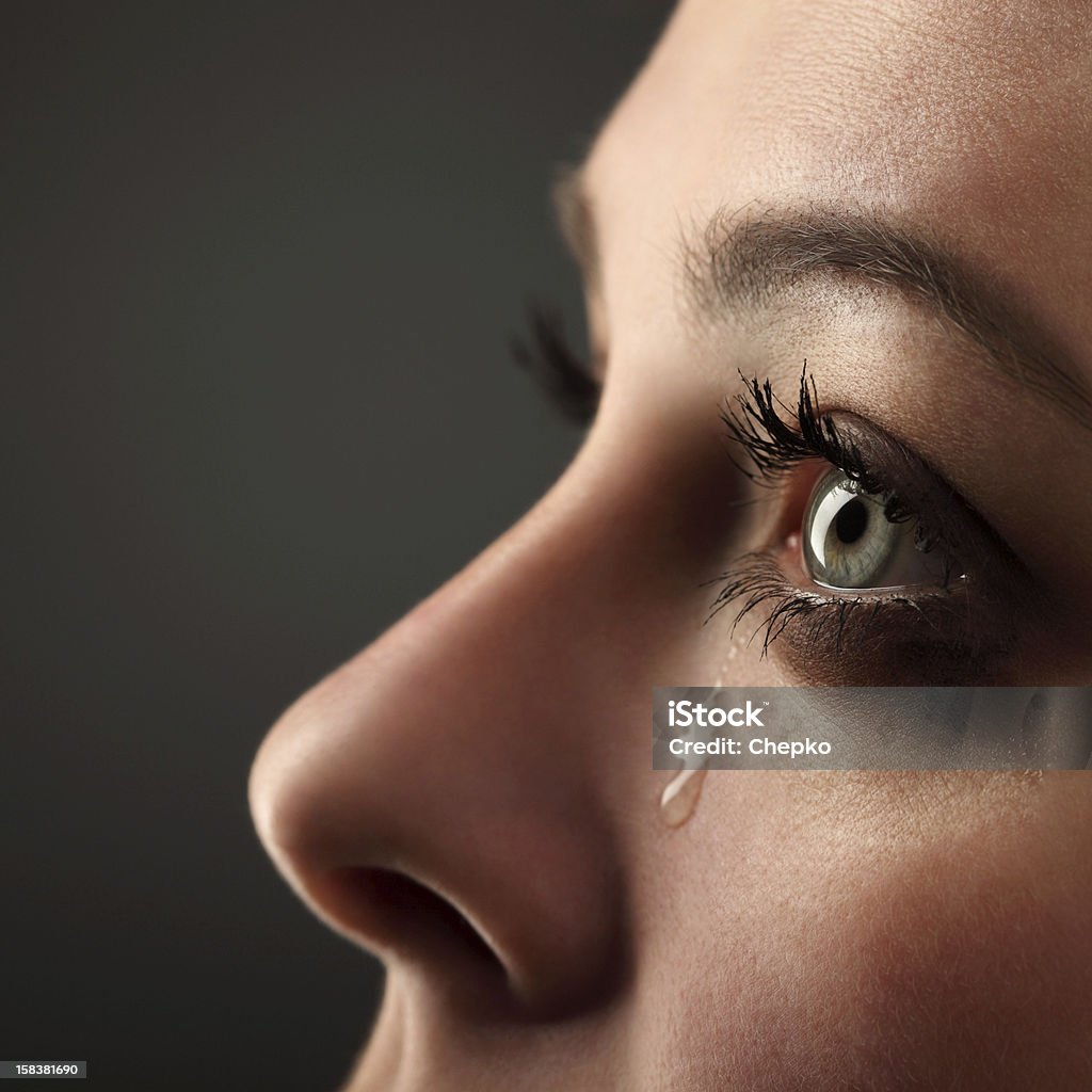 Teardrop falling from woman's eye beauty girl cry Crying Stock Photo