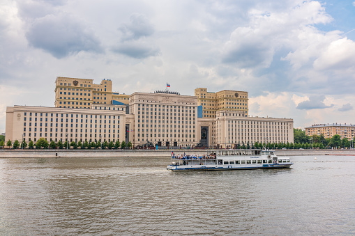 Moscow, Russia - July 28, 2022: View of the Ministry of Defence of Russian Federation, and Moscow river embakmenTranslation of the inscription on the facade - Ministry of Defense of the Russian Federation