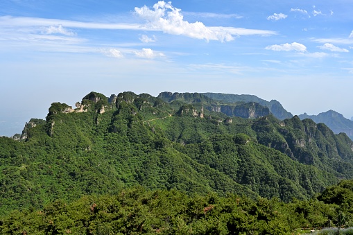 Shanxi Province, Lingchuan County, Mt Wangmang scenery spot.\nWith a total area of more than 150 square kilometers, Mt Wangmang scenery spot is the highest peak in South Taihang, with the highest altitude of more than 1700 meters and the lowest about 300 meters. The sea of clouds, sunrise, strange peaks, pine waves, wall highway, Red Rock Grand Canyon, and three-dimensional waterfall in Wangmang Ling Scenic Area form the most famous natural landscape of Taihang in 800 miles. It is a national geopark, a national AAAA tourist attraction, a national outdoor fitness base, and a national agricultural tourism demonstration site.
