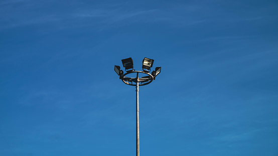 Spotlight tower with blue sky background