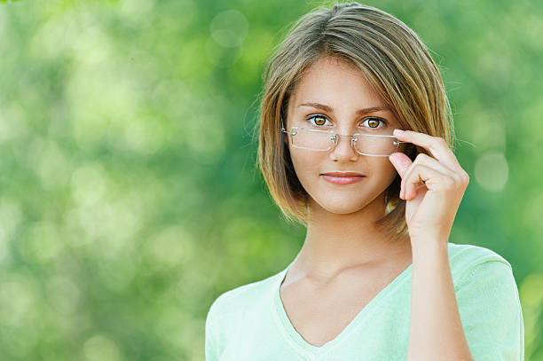 istock smiling beautiful young woman with glasses 158390966