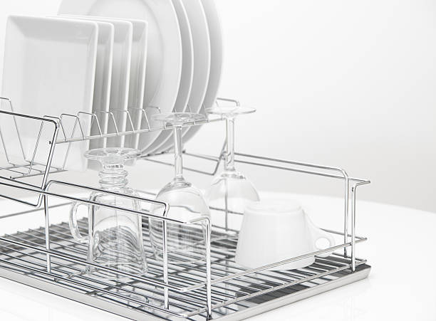 istock Dishes and glasses drying on metal dish rack 158392494