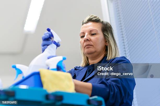 Woman Working As Professional Cleaner In Office Stock Photo - Download Image Now - Cleaner, Serious, Housekeeping Staff