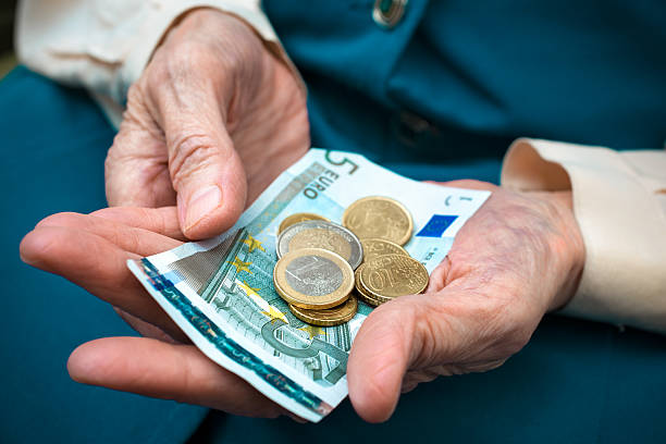 istock Senior woman counting money 158393199