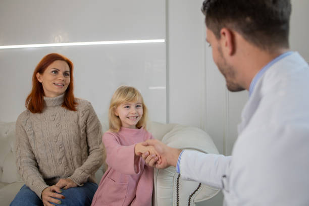 istock Mother with her daughter at the dentist office 1583955483