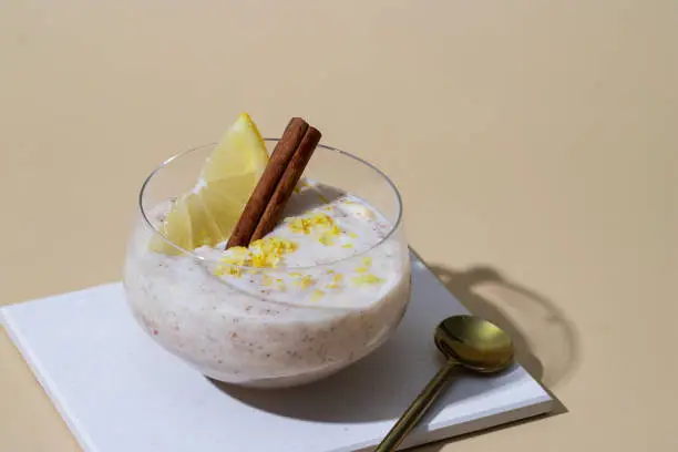 Photo of Arroz con leche popular spanish dessert made with milkor  and sweeet rice y decorated with   lemon and Cinnamon