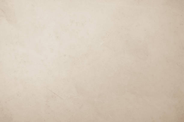 istock Colour old concrete wall texture background. Close Up retro plain cream color cement wall background texture. Design paper vintage parchment element show or advertise or promote product on display. 1583963867