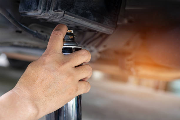 istock Basic vehicle inspection and maintenance, Close up hand a man holding anti-rust paint spraying car undercarriage to prevent rust, Car good protection and service concept by myself 1583976288