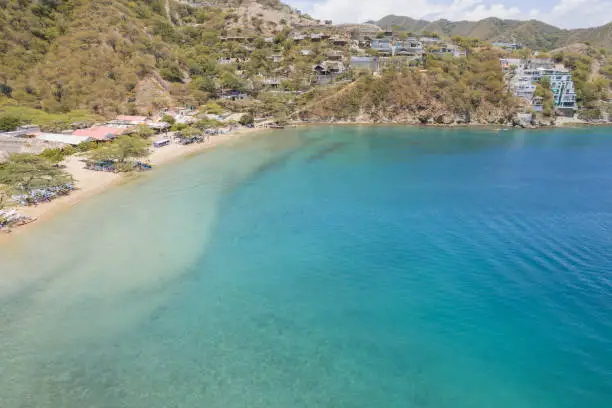 Photo of bay of Taganga and the arid mountains and the green of the trees