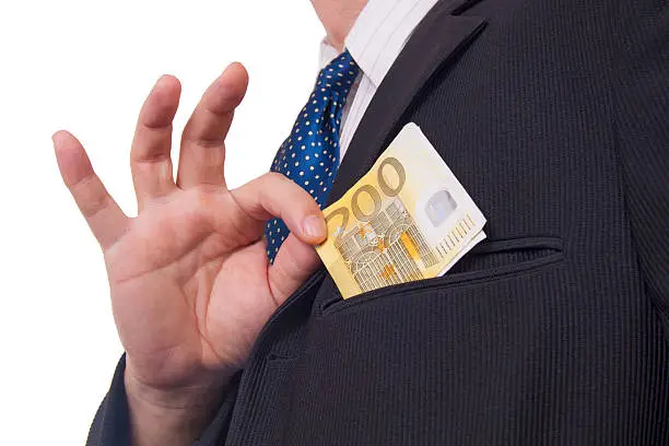 Man in a Black Suit Putting Two Hundred Euros Banknote In His Pocket Isolated on White Background
