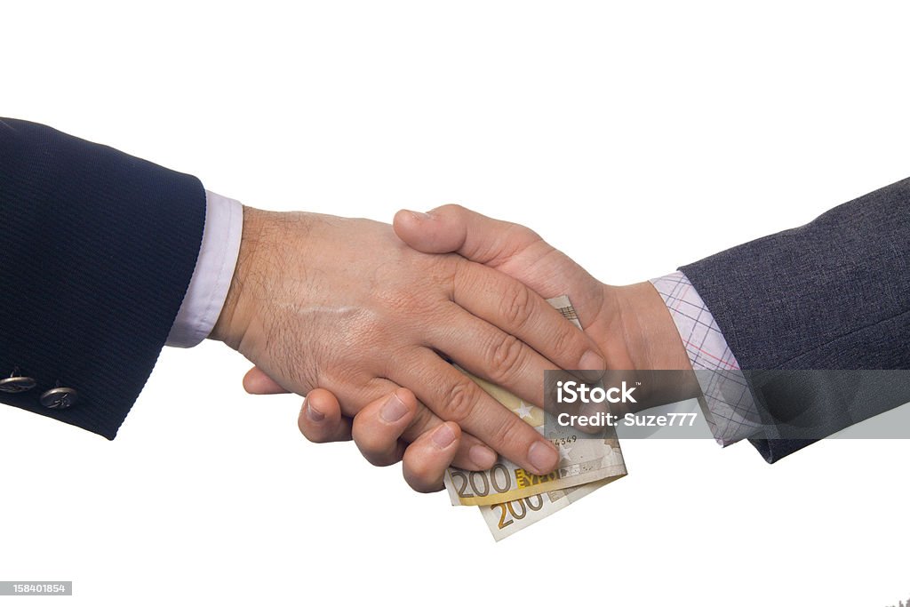 Taking Bribes Men in suits shaking hands and taking two hundred euros bribe Adult Stock Photo