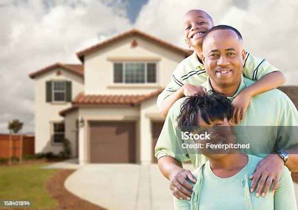 Attractive African American Family In Front Of Home Stock Photo - Download Image Now