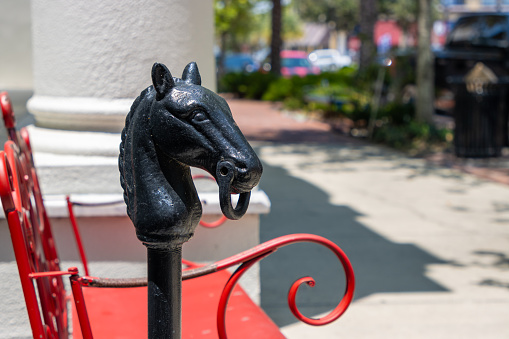 A metal hitching post shaped like a horse.