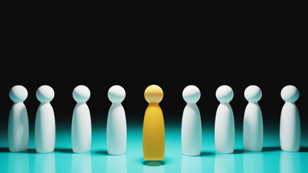 istock Row of white and yellow plastic figures as representation of people, teamwork theme, 3d illustration 1584043297