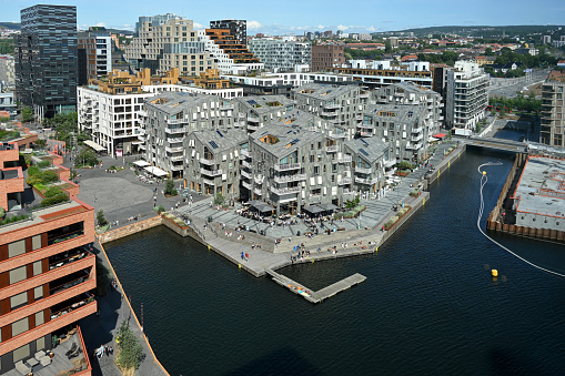 Oslo, Norway, July 5, 2023 - The modern barcode neighborhood on the Bjorvika Canal in Oslo.
